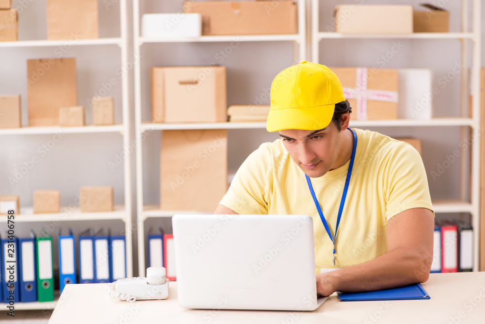 Handsome contractor working in box delivery relocation service Handsome contractor working in box delivery relocation service