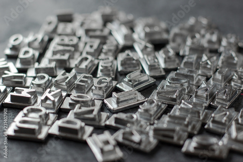 Valokuva Metal Letterpress Types on black background with copy space