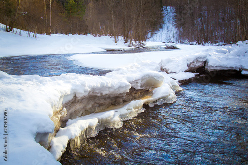 Winter. The river is freezi...