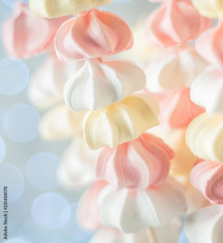 Yellow, white and pink sweets on stick. Bokeh as background Yellow, white and pink sweets on stick. Bokeh as background