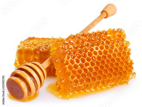 Honey with honeycomb on white background