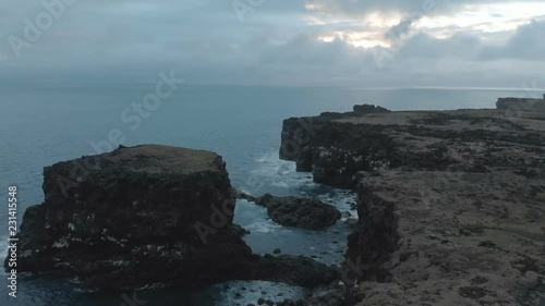 Waves breaking on the black rock cliff of western Icelandic coast, Snaefellsnes Peninsulain, Iceland.
