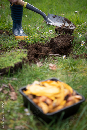 digging soil for compost