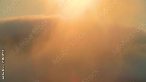 The sun burns a heavy rolling fog in the Marin Headlands California photo