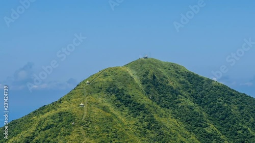 Timelapse of Keelung mountain in New Taipei city. Beauty Hyperlapse of landscape of green mountains with blue sky. Scenic of journey tourism in a beautiful day of summer in Jishan, Ruifang-Dan photo