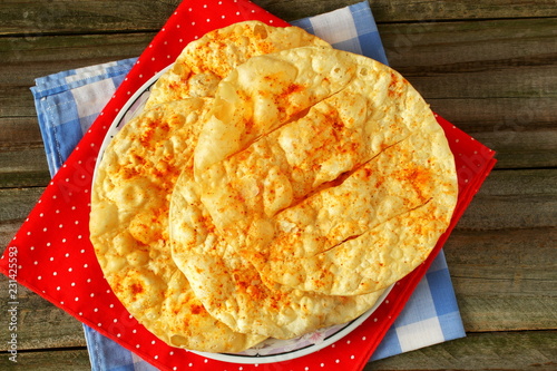 traditional indian gujarati food snack mathia papad or salted spicy fried puri photo