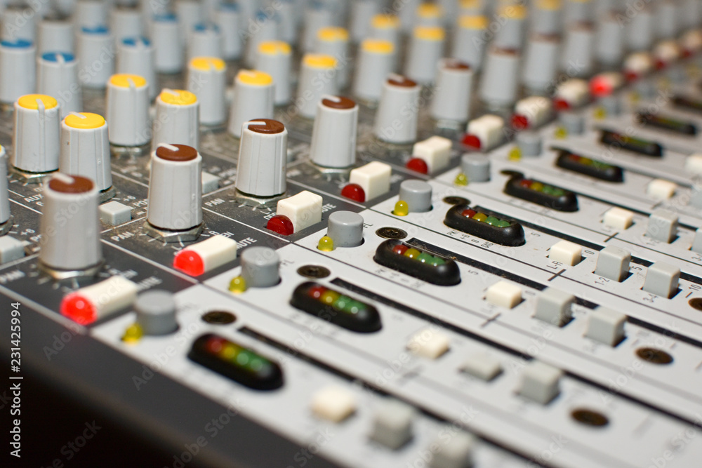 Close up shot of buttons, dials and controls of sound board Close up shot of buttons, dials and controls of sound board