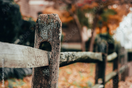 Close up of rustic wooden post in fence