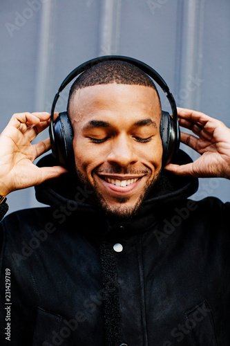 Portrait of young man using headphones