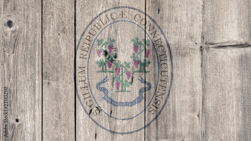 USA Politics News Concept: US State Connecticut Seal Wooden Fence Background