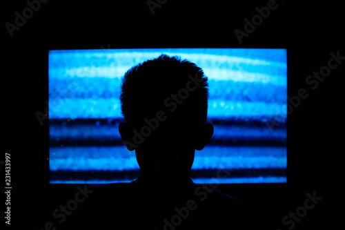 Fotografie Boy watching television with noise