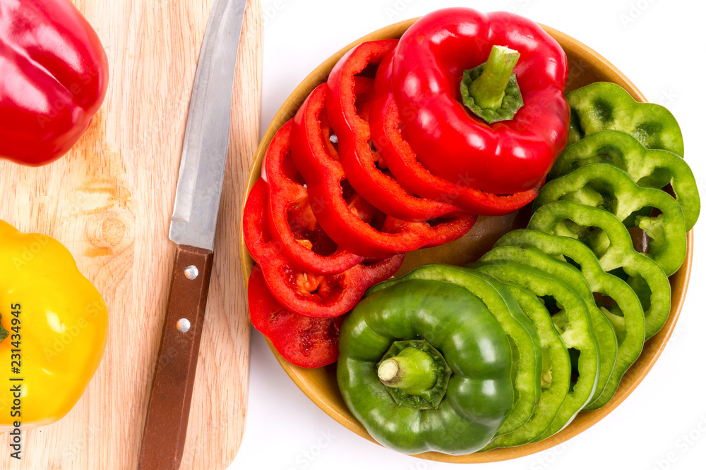 slices of red bell pepper and green bell pepper on isolated white background slices of red bell pepper and green bell pepper on isolated white background