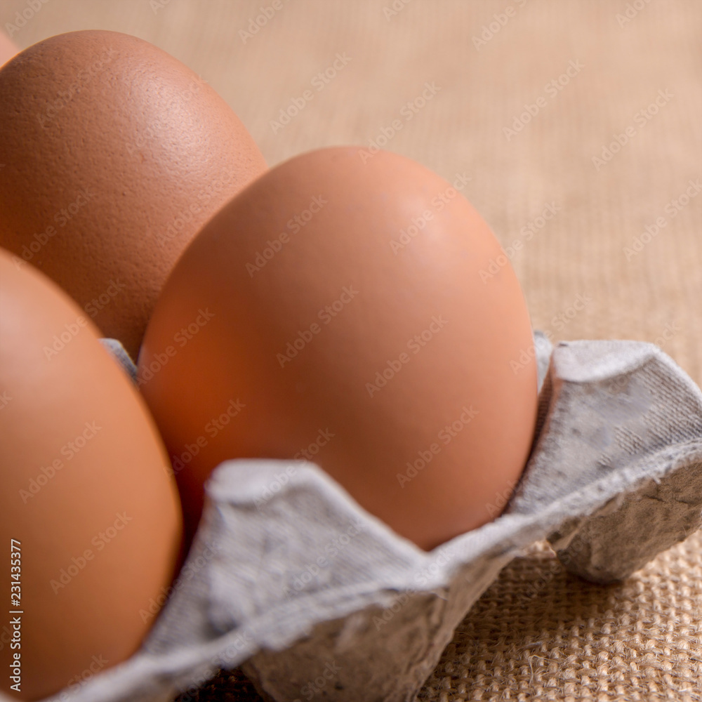 Fresh organic panel eggs on sackcloth with copy space for text Fresh organic panel eggs on sackcloth with copy space for text