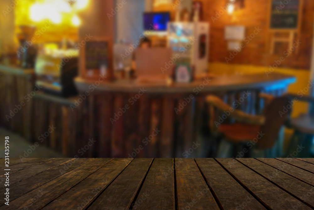 empty wooden table on on coffee shop background, with copy space empty wooden table on on coffee shop background, with copy space