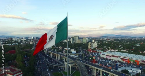Aerial view of a huge mexican flag fluttering, Mexico City. TK9