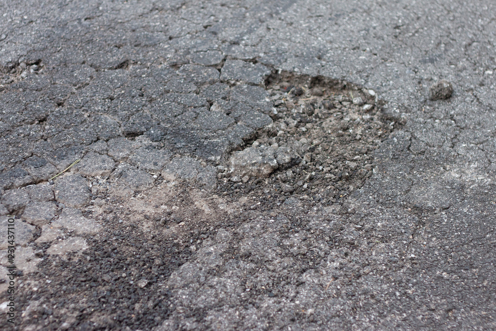 Asphalt floors are broken from non-standard construction.