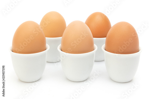 Brown Eggs  in ceramic cup at White Background