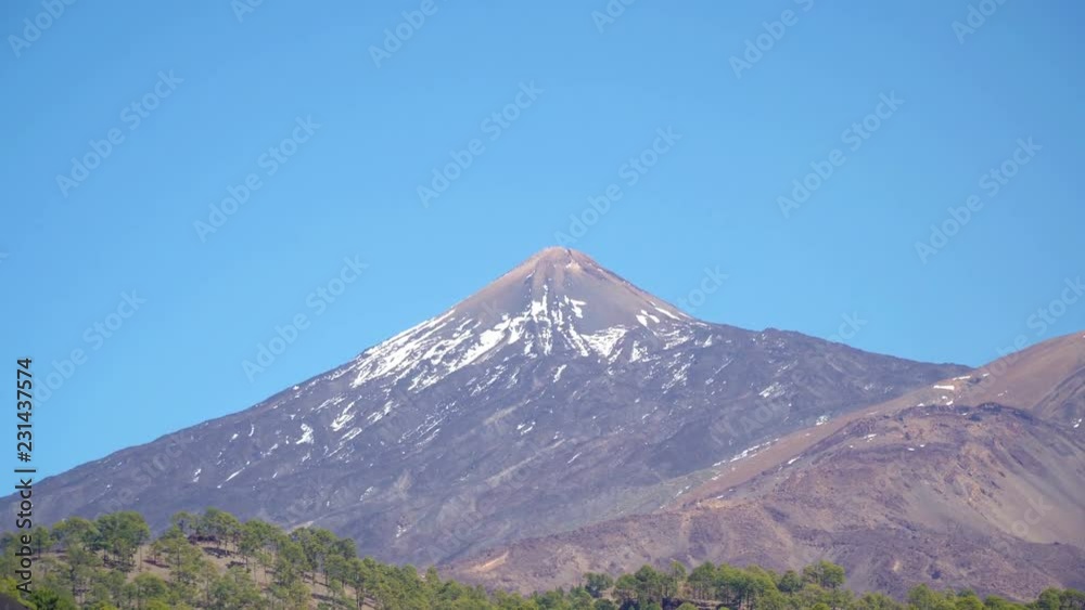 Teide volcano mountain with snowy peak in Teide National Park, Tenerife, Canary Islands, Spain Teide volcano mountain with snowy peak in Teide National Park, Tenerife, Canary Islands, Spain