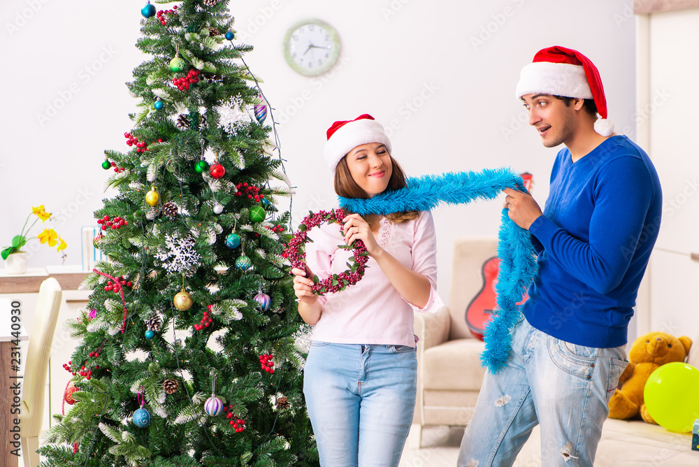 Young family celebrating christmas at home Young family celebrating christmas at home