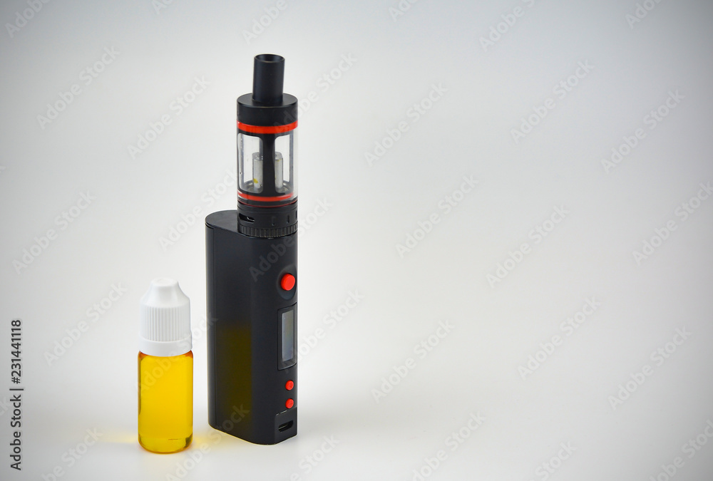 E - cigarette for vaping , technical devices.The liquid in the bottle   