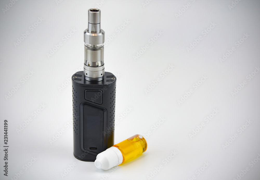 E - cigarette for vaping , technical devices.The liquid in the bottle E - cigarette for vaping , technical devices.The liquid in the bottle