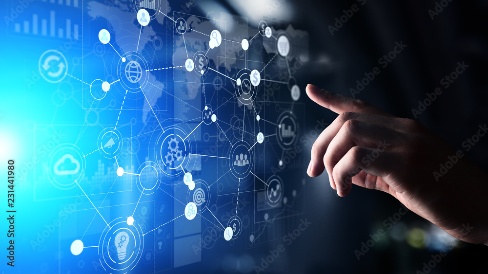 Mixed media. Business Organisational structure on virtual screen with process icons.