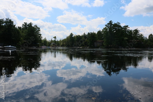 Fototapeta Naklejka Na Ścianę i Meble -  Cottage Sky Reflection Lake