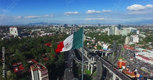 Aerial view of a huge mexican flag fluttering, Mexico City. TK3