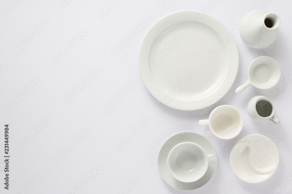 empty set of dishes on white background empty set of dishes on white background