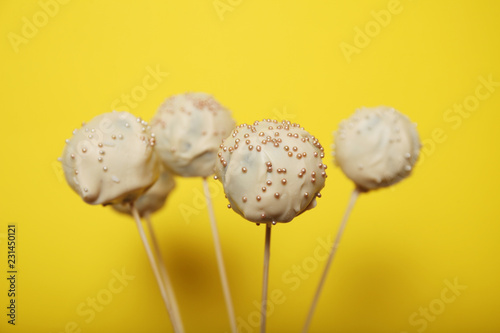 Fun cake pop ball. White chocolate sweet dessert. photo