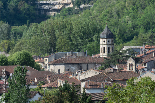 View over ancient rooftops in Ariege  France  with spire and forests in background