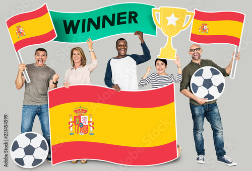 Diverse football fans holding the flag of Spain