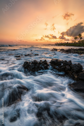 Evening Sunset at a Tropical Rocky Beach