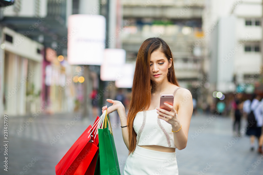 Woman shopping in a mall. Woman shopping in a mall.