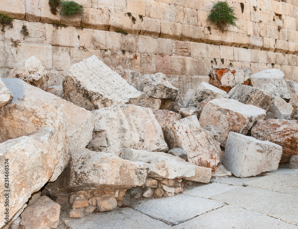 closeup of stones thrown from the second temple to the street below after the destruction of the temple in 70 CE - obrazy, fototapety, plakaty 
