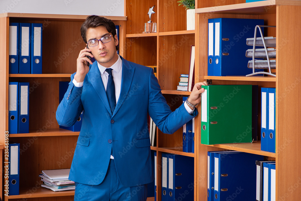 Young employee working in the office Young employee working in the office