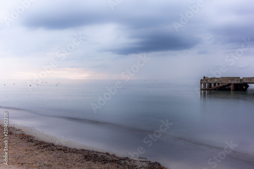 An abandoned pier on the Tuscan sea in Autumn at sunset with long exposure effect - 2 © gdefilip