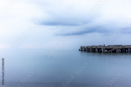 An abandoned pier on the Tuscan sea in Autumn at sunset with long exposure effect - 3 © gdefilip