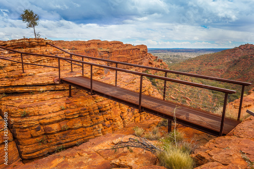 Cotteril's Bridge crosses a deep crevice providing access to spectacular views from the north wall, Kings Canyon, Northern Territory, Australia photo