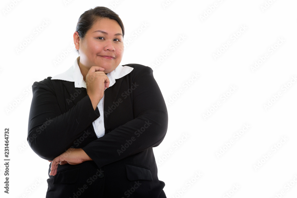Studio shot of young fat Asian businesswoman thinking Studio shot of young fat Asian businesswoman thinking