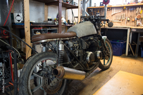 Custom made motorcycle. Indoors of custom motorcycle workshop. Close up shoots of customized motorcycle.