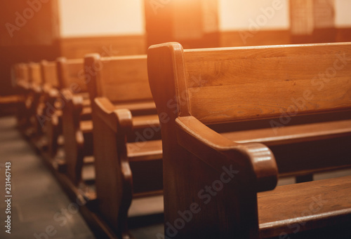 Fototapeta Rows of church benches. Selective focus.
