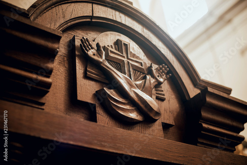 Wooden window of confessional box at church