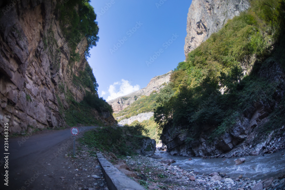 Cycling mountain road. Misty mountain road in high mountains.. Cloudy sky with mountain road. Summertime