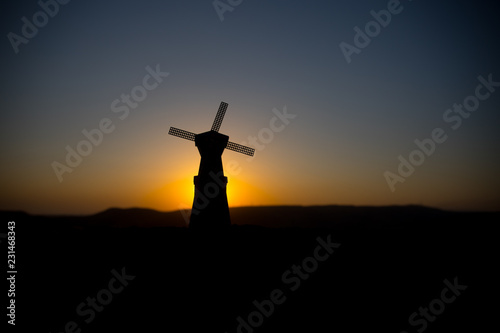 Traditional, Dutch windmill at a hill during a summer sunset. Decoration.