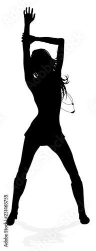 A young woman in silhouette dancing like at a night club or other event