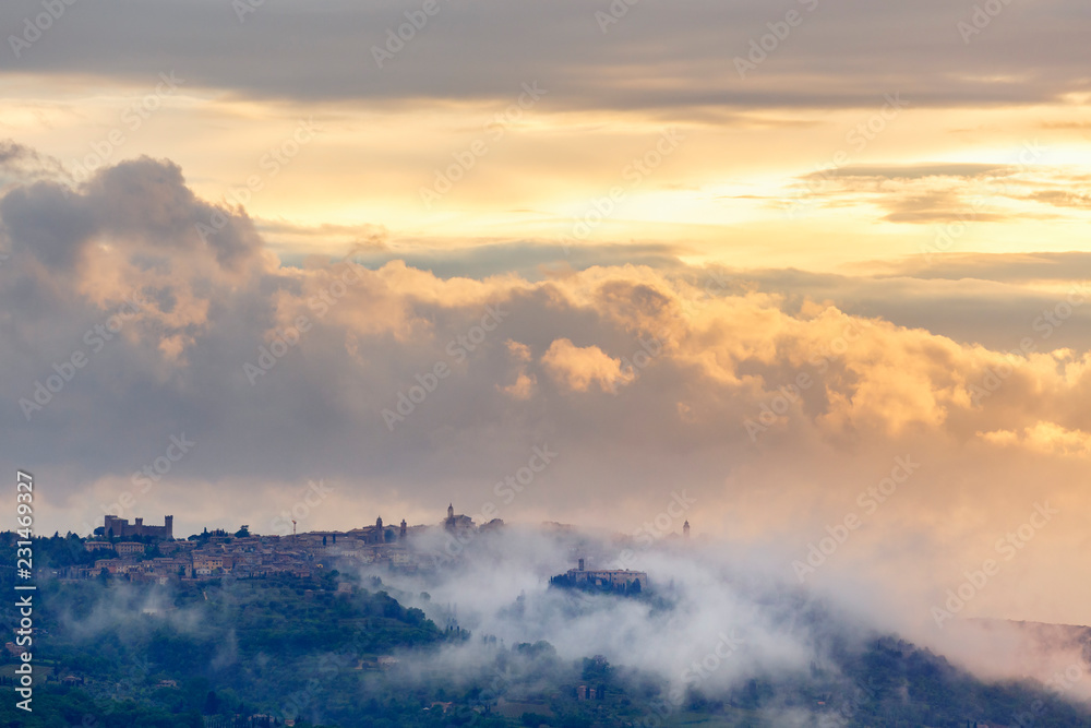 Mountain village with clouds at dusk