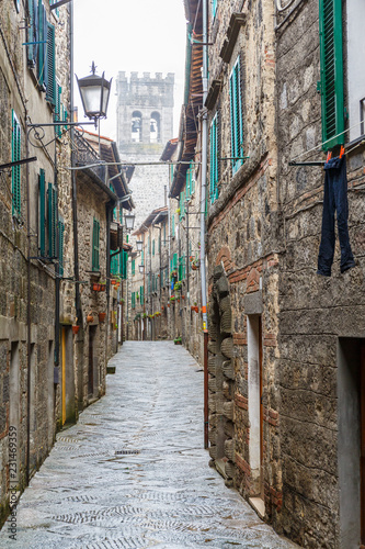 Pants hanging out to dry in an alley