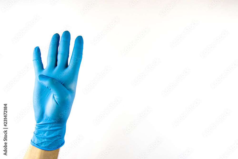 Obraz premium Male hand in medical glove on white background.