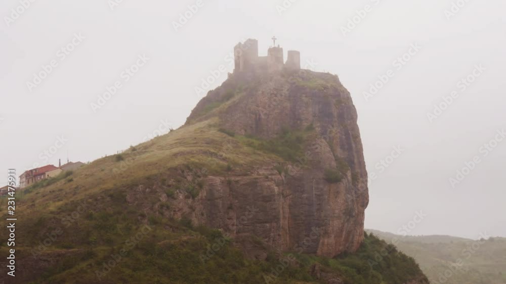 Beautiful Time-lapse of Clavijo Castle on hillttop surrounded by fog – medium shot Beautiful Time-lapse of Clavijo Castle on hillttop surrounded by fog – medium shot